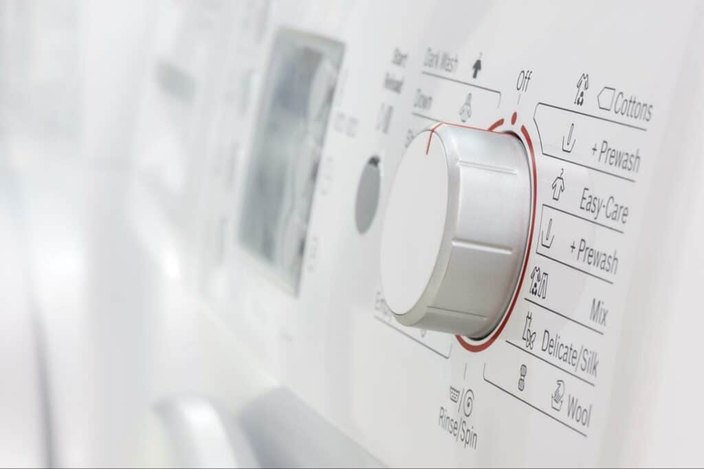 Washing machine settings dial for various laundry cycles and options.