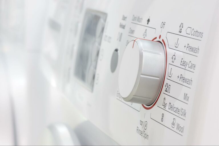 Washing machine settings dial for various laundry cycles and options.