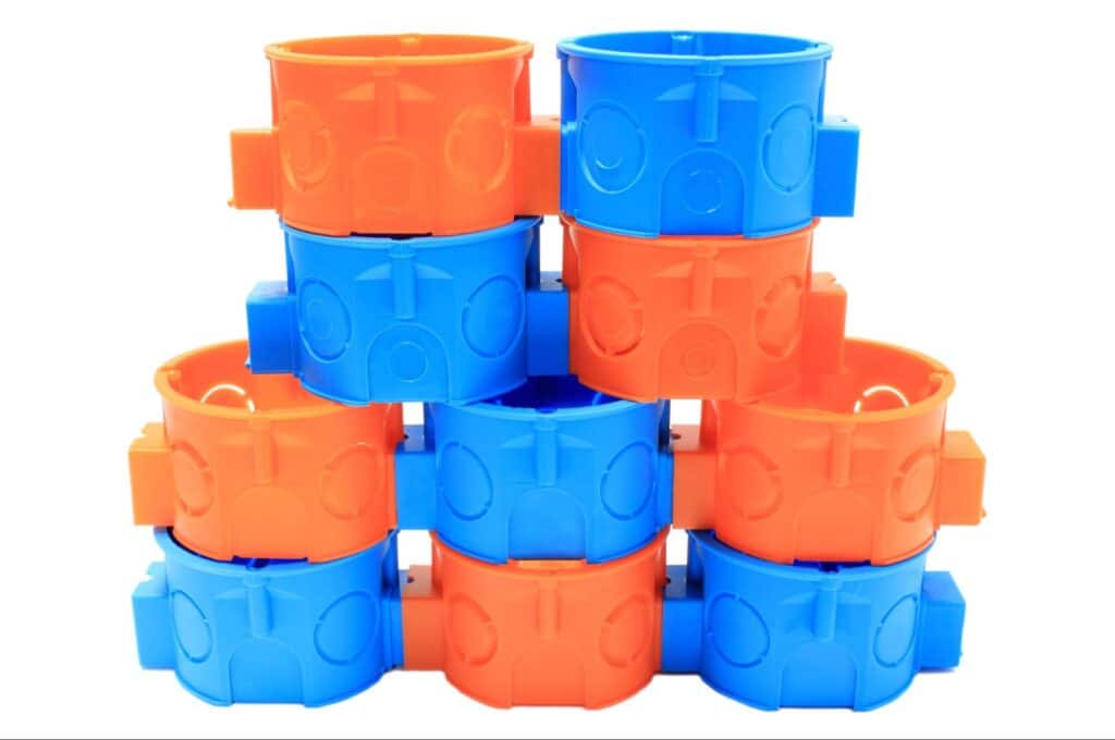 Bright blue and orange stacked cups for vibrant kitchen decor.
