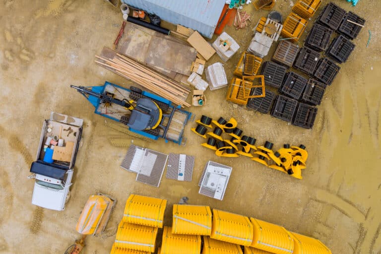 Construction site overview showcasing equipment and materials for stormwater drain installation.