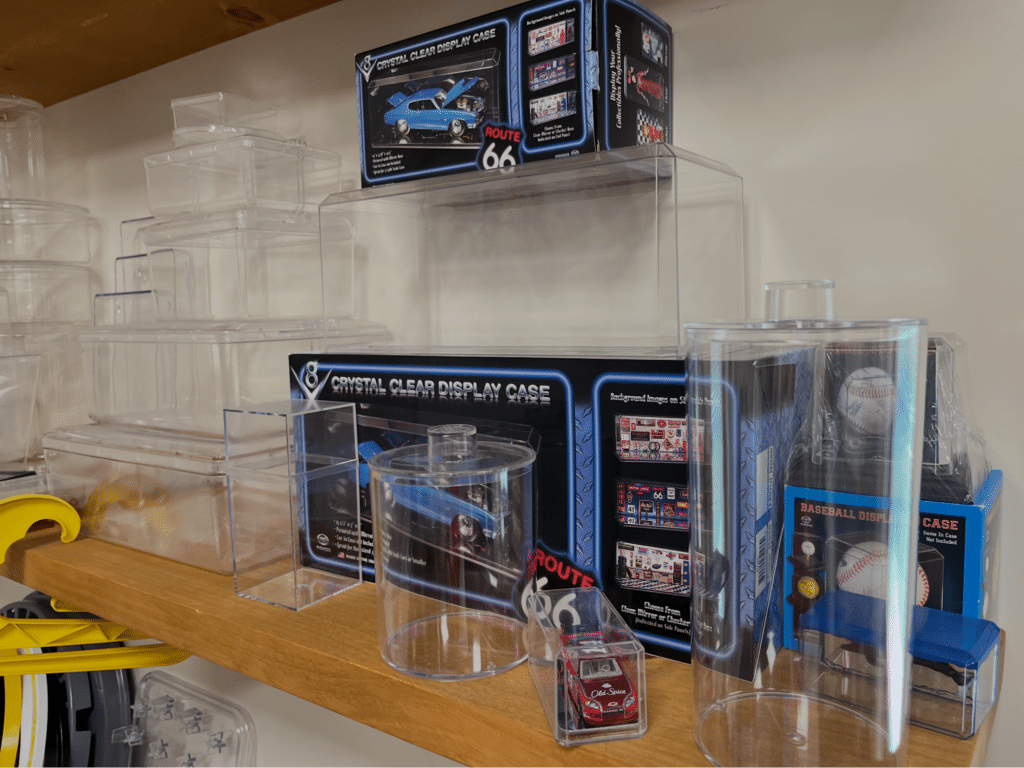 Made in the USA display cases at Pioneer Plastics showcasing various models and storage options for cherished items.